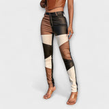 Calças de tubo com padrão de blocos de cores